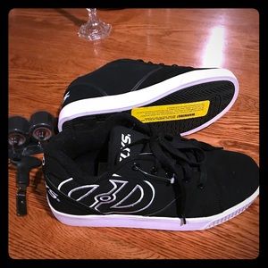New in box Heelys, includes wheels and tool